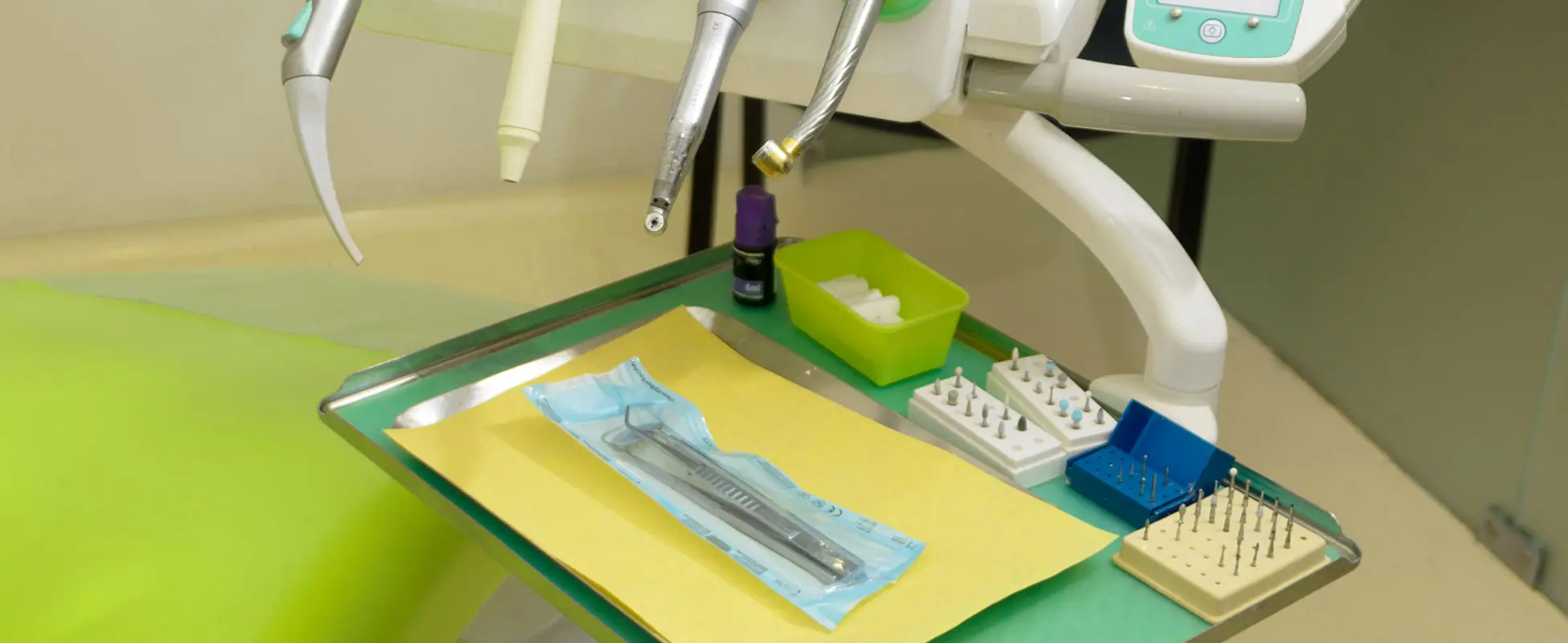 Clinical instruments laid out on a treatment room counter